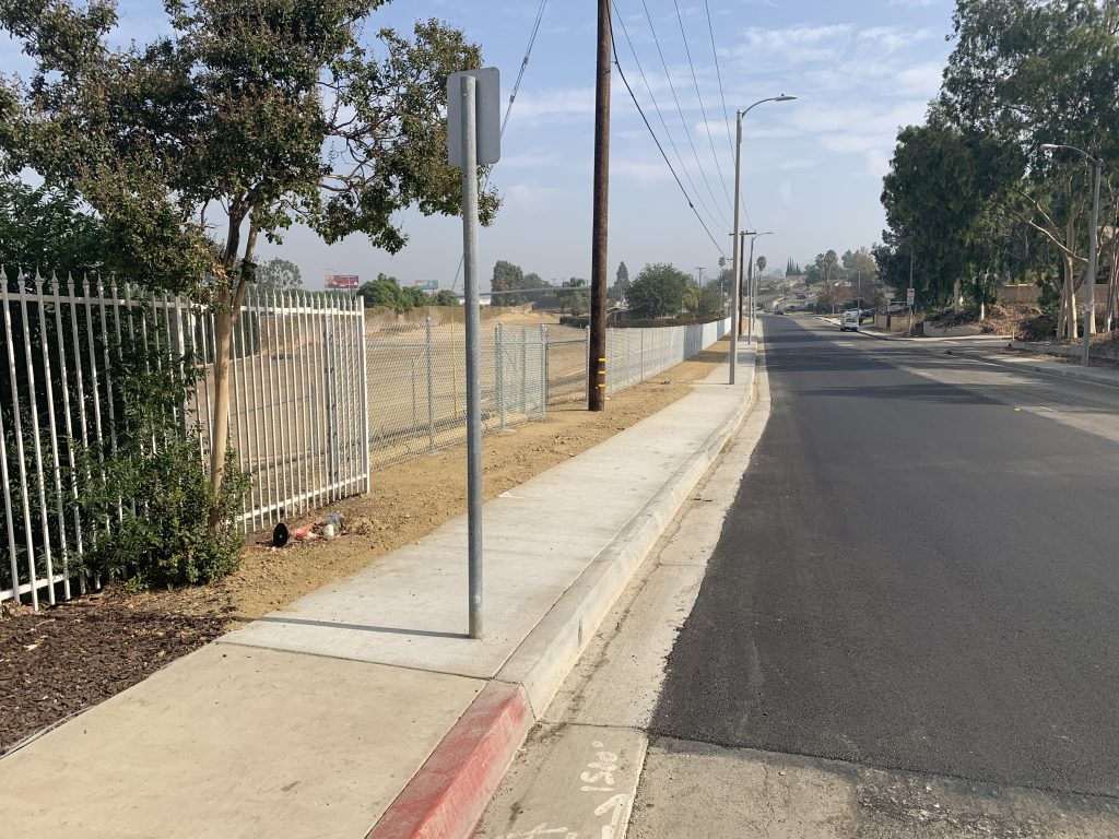 Empty street with fence
